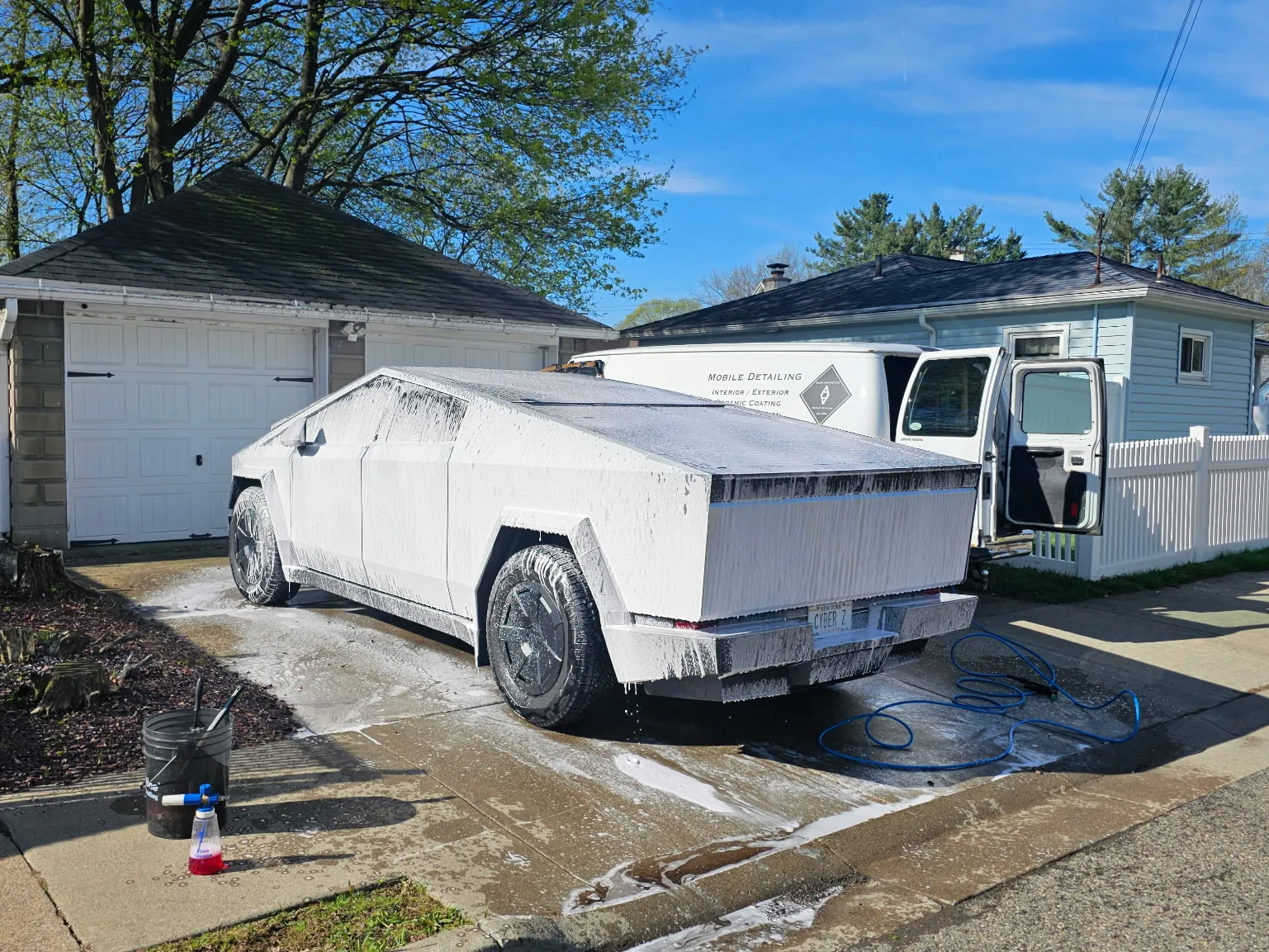 The Auto Aesthetics mobile detailing van servicing a vehicle on site during a fleet visit near Binghamton, NY