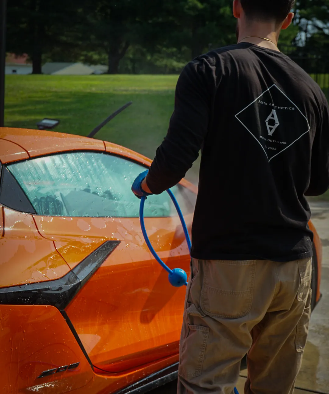 Auto Aesthetics detailing a customer Corvette on site during a monthly maintenance plan visit near Binghamton, NY